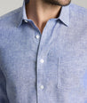 Model wearing an UNTUCKit Mid Blue Wrinkle-Resistant Linen Vin Santo Shirt