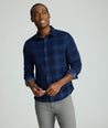 Model is wearing Cord Shirt in Navy Plaid.