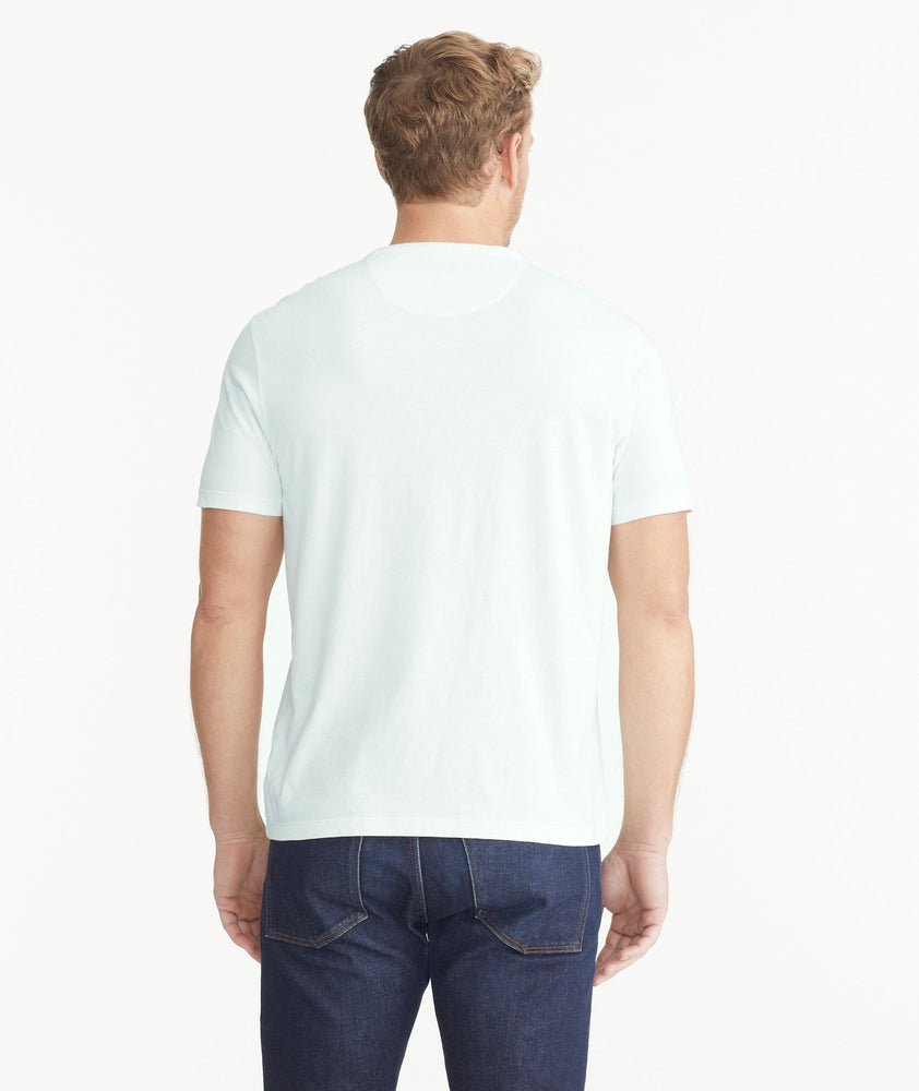 Model wearing an UNTUCKit Light Blue Mineral Dye Pocket Tee