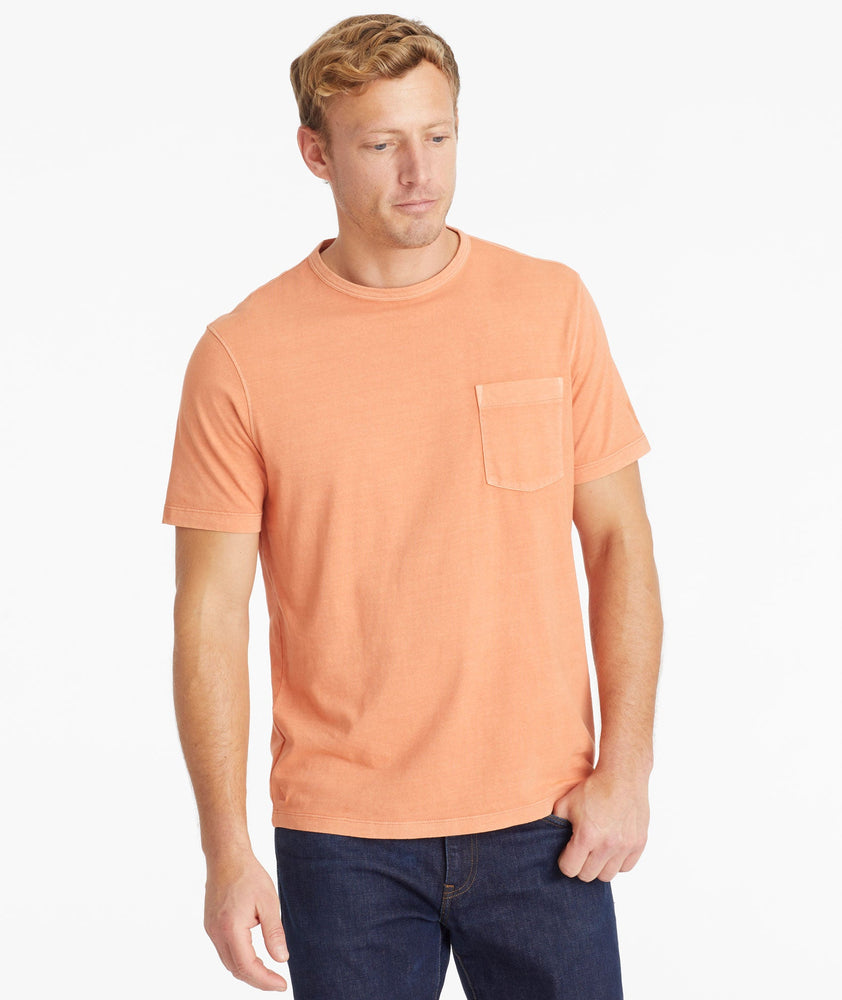 Model wearing an UNTUCKit Orange Mineral Dye Pocket Tee