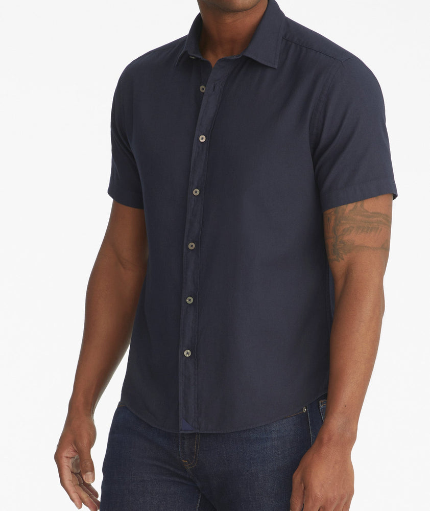 Model is wearing UNTUCKit Soft Wash Short-Sleeve Briscoe Shirt.