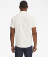 Model is wearing UNTUCkit white Briscoe short-sleeve button down.
