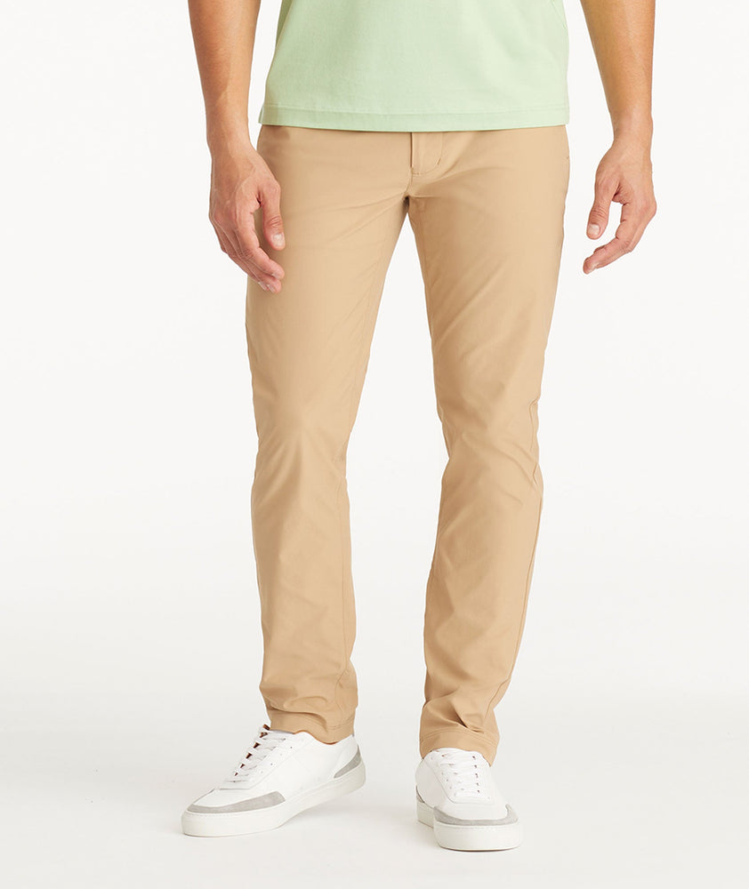 Model wearing UNTUCKit Tan Traveler Pants