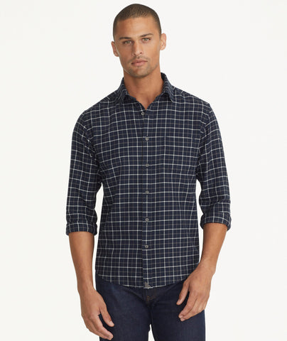 Model is wearing UNTUCKit Flannel Morisco Shirt in Navy & White Windowpane Check